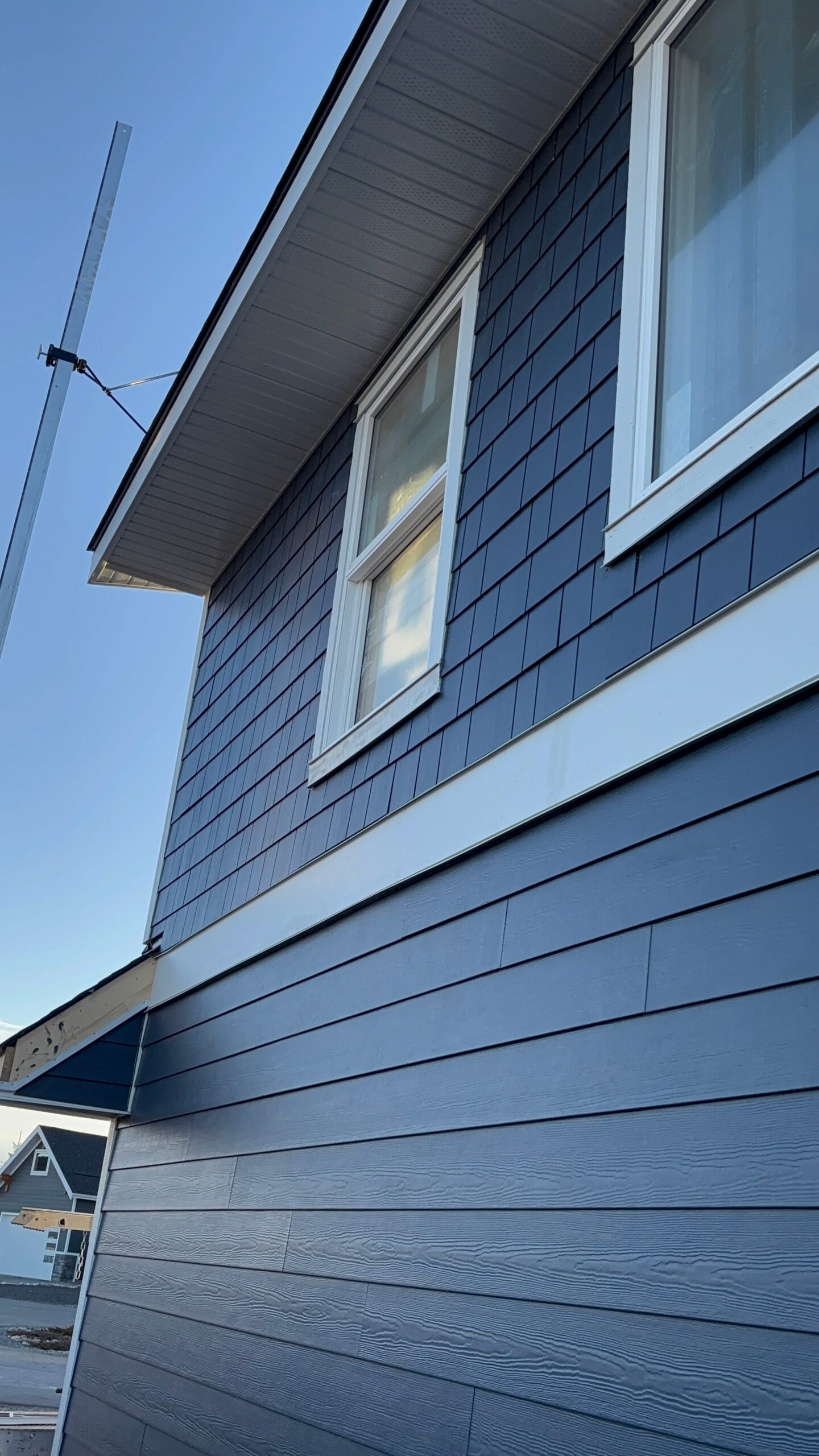 Hardie Shingle Siding Installation in Cochrane, Alberta - Maxima Construction Ltd